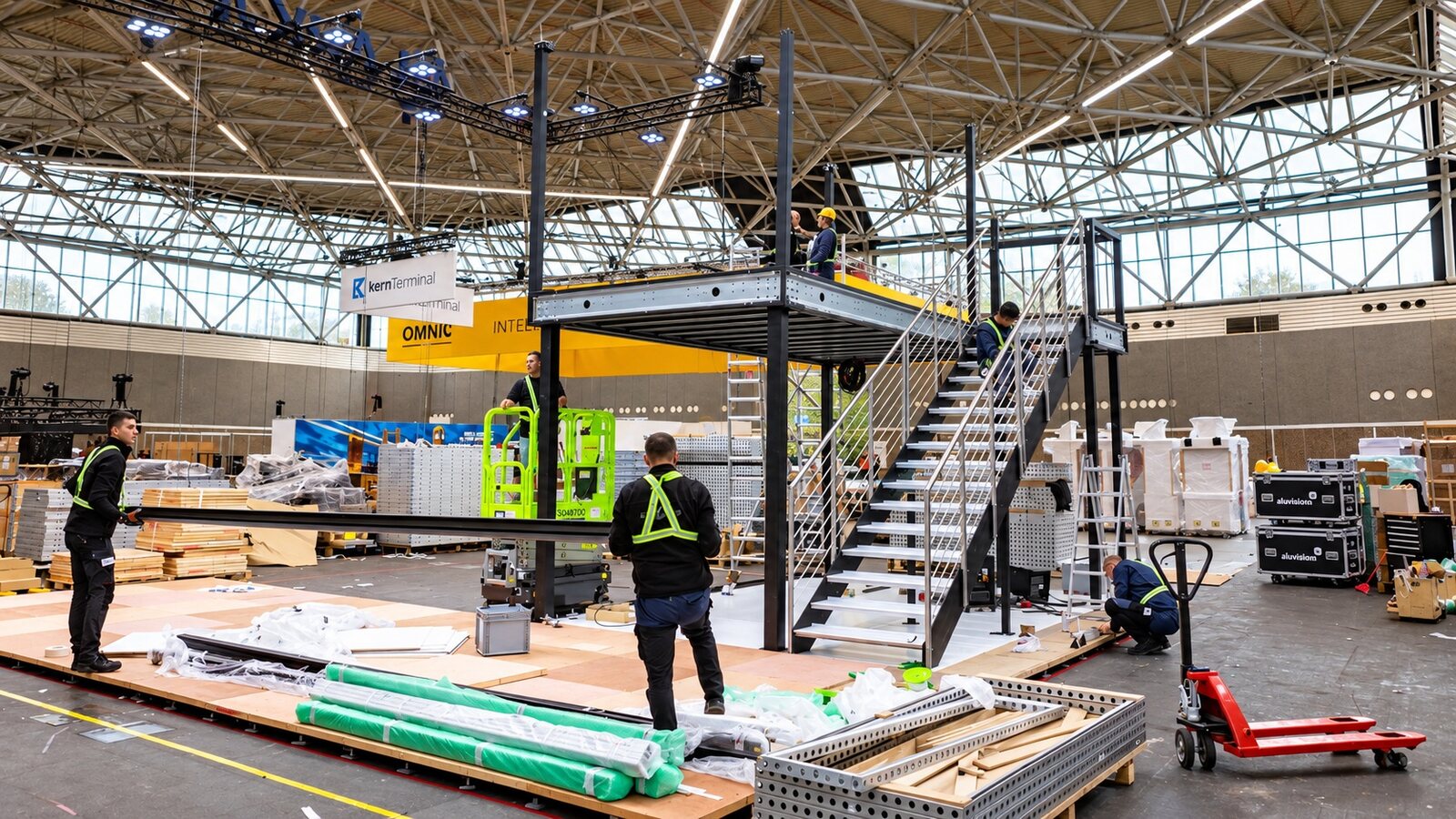 Cool Promotions build up crew assembling a double deck exhibition stand in a European hall